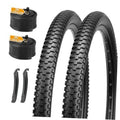 Two black mountain bike tires with thick knobby tread and sidewall studs