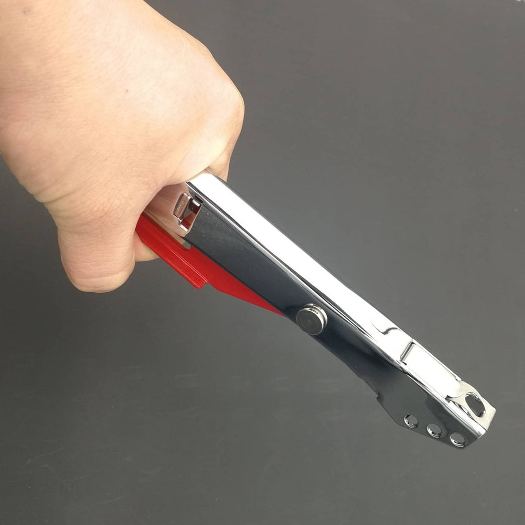 Hand holding silver-and-red torch striker lighter with visible trigger area