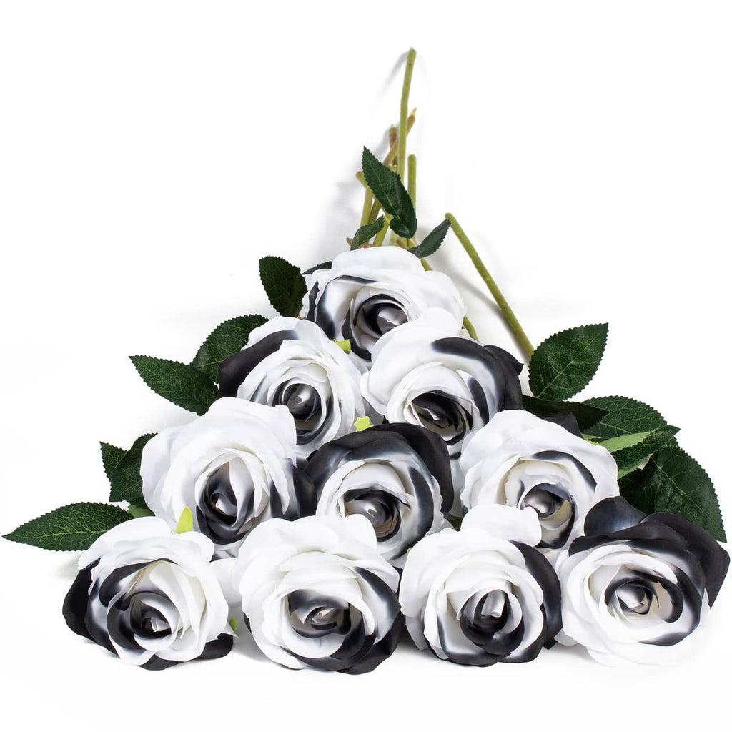 Artificial silk rose bouquet with white and black blooms and green leaves