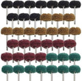 Mounted abrasive buffing wheels set on metal shafts; black, brown, red, and green heads.