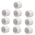 Set of white PVC pipe end caps, open cylindrical ends