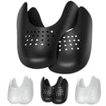 Black shoe crease protectors, pair with curved shape and vent holes for sneakers.