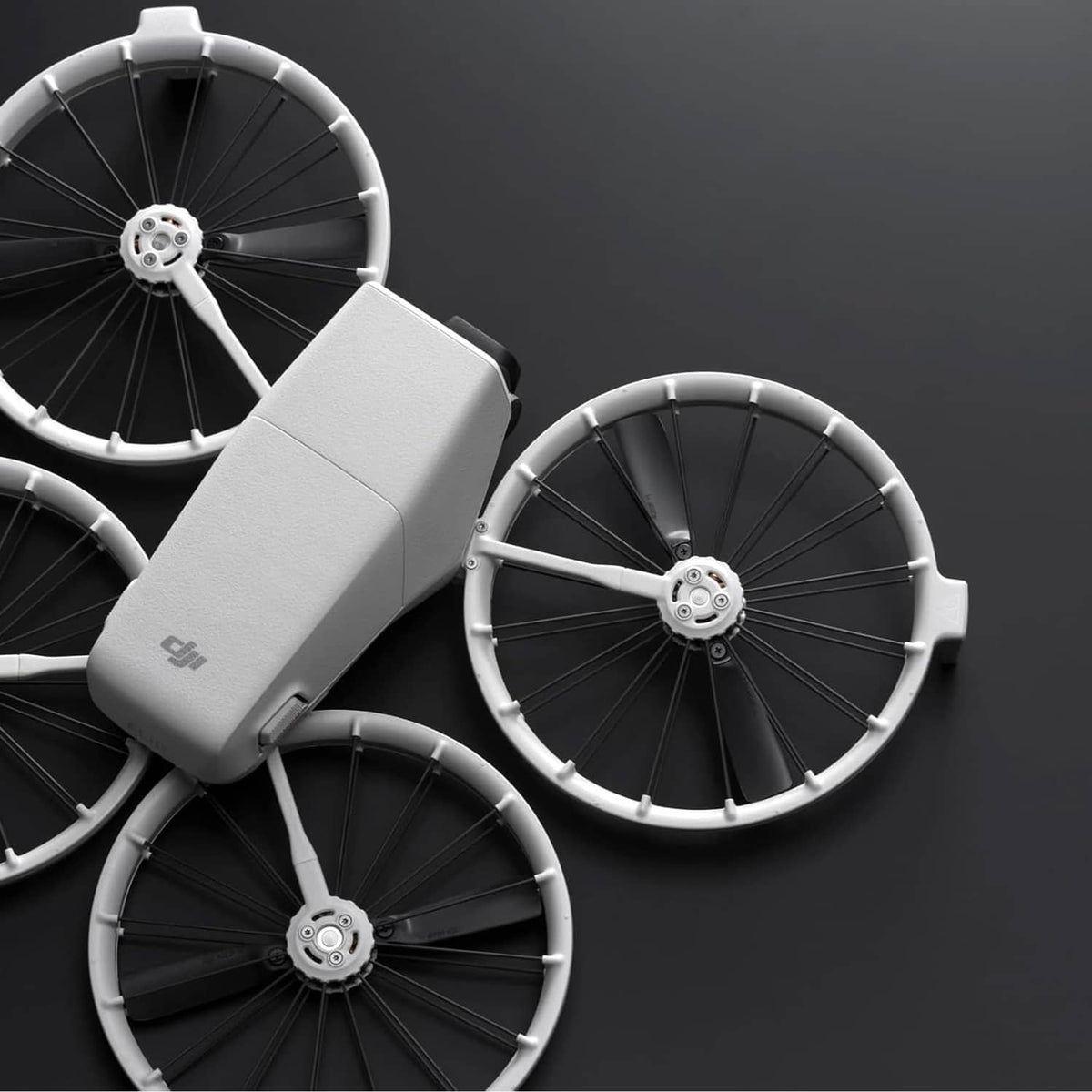 DJI Flip propeller blades and arm hub detail, showing dark hub and gray blades