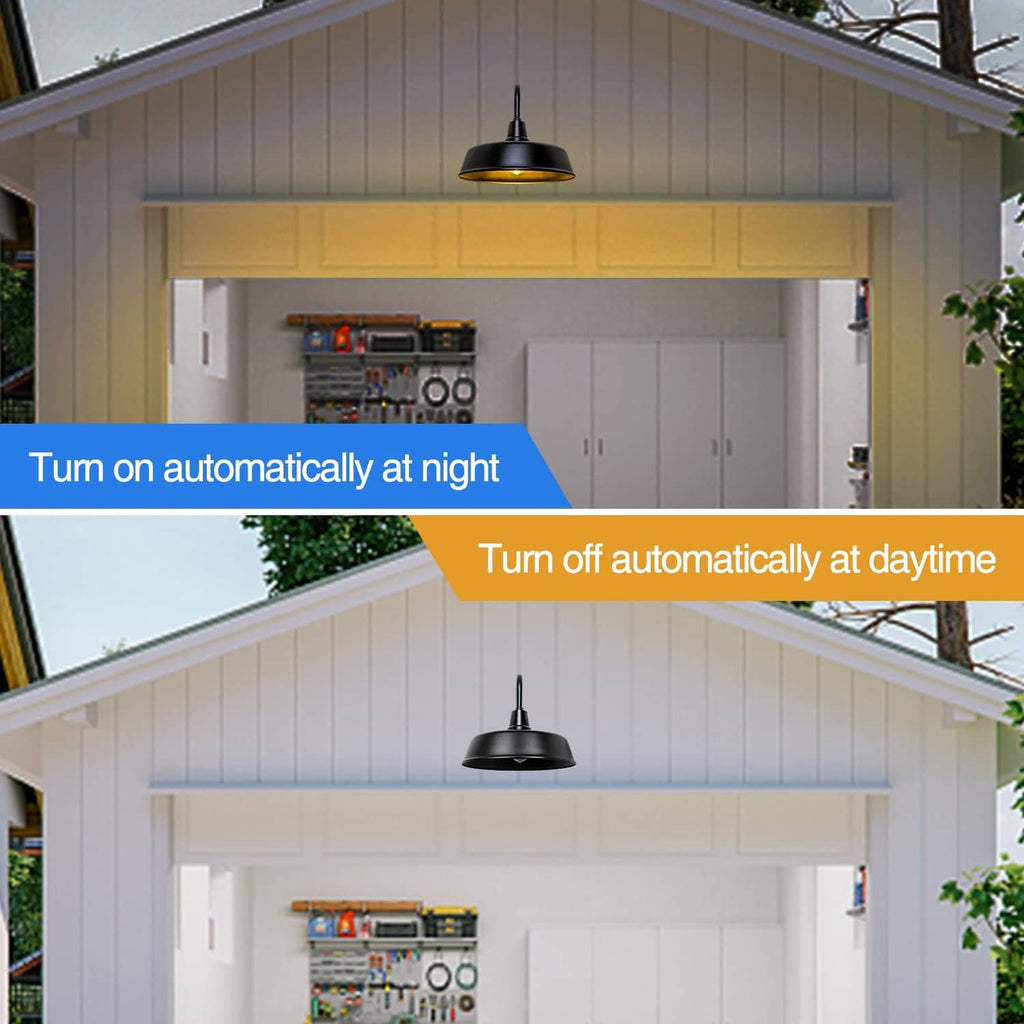 Black gooseneck barn light under porch eave with warm illumination
