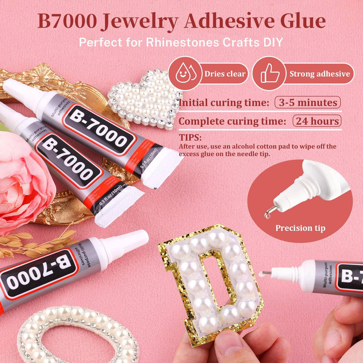 White flatback pearls arranged for rhinestone-style DIY craft on a flat surface