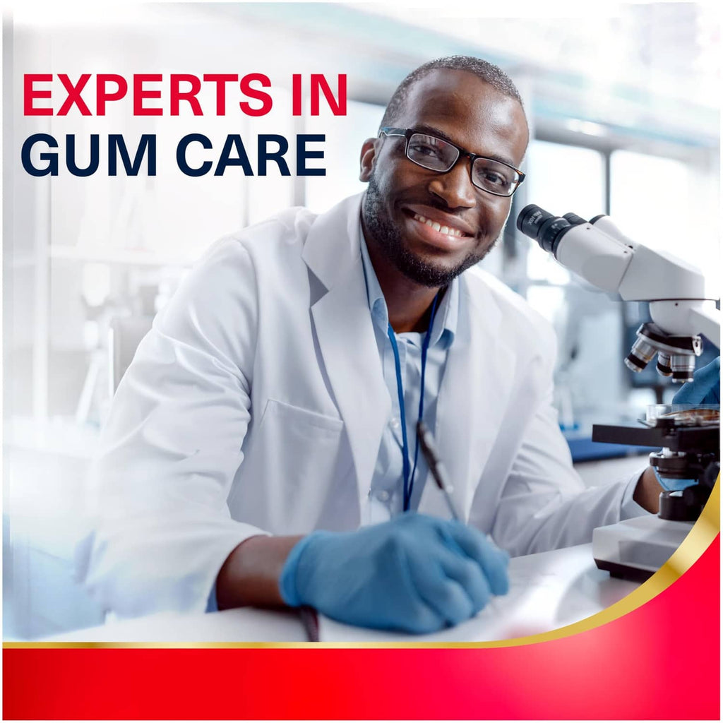 Doctor using microscope in gum care ad featuring toothpaste for gum health
