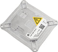 Silver HID headlight ballast module with mounting holes and warning label