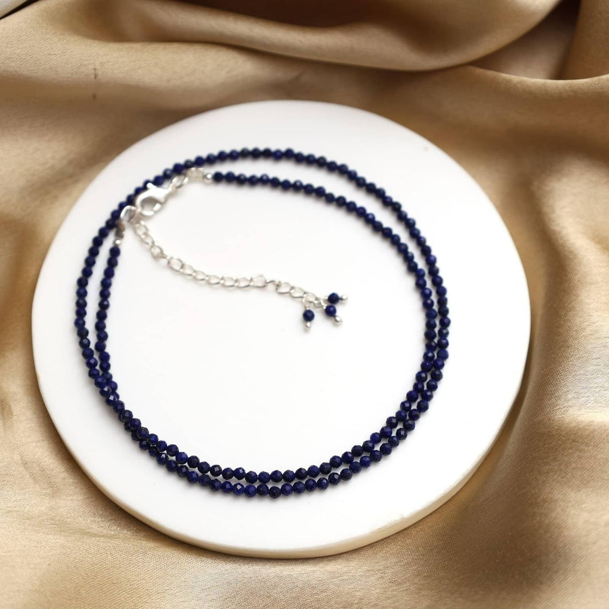 Lapis lazuli beaded necklace with silver chain and small blue accent beads