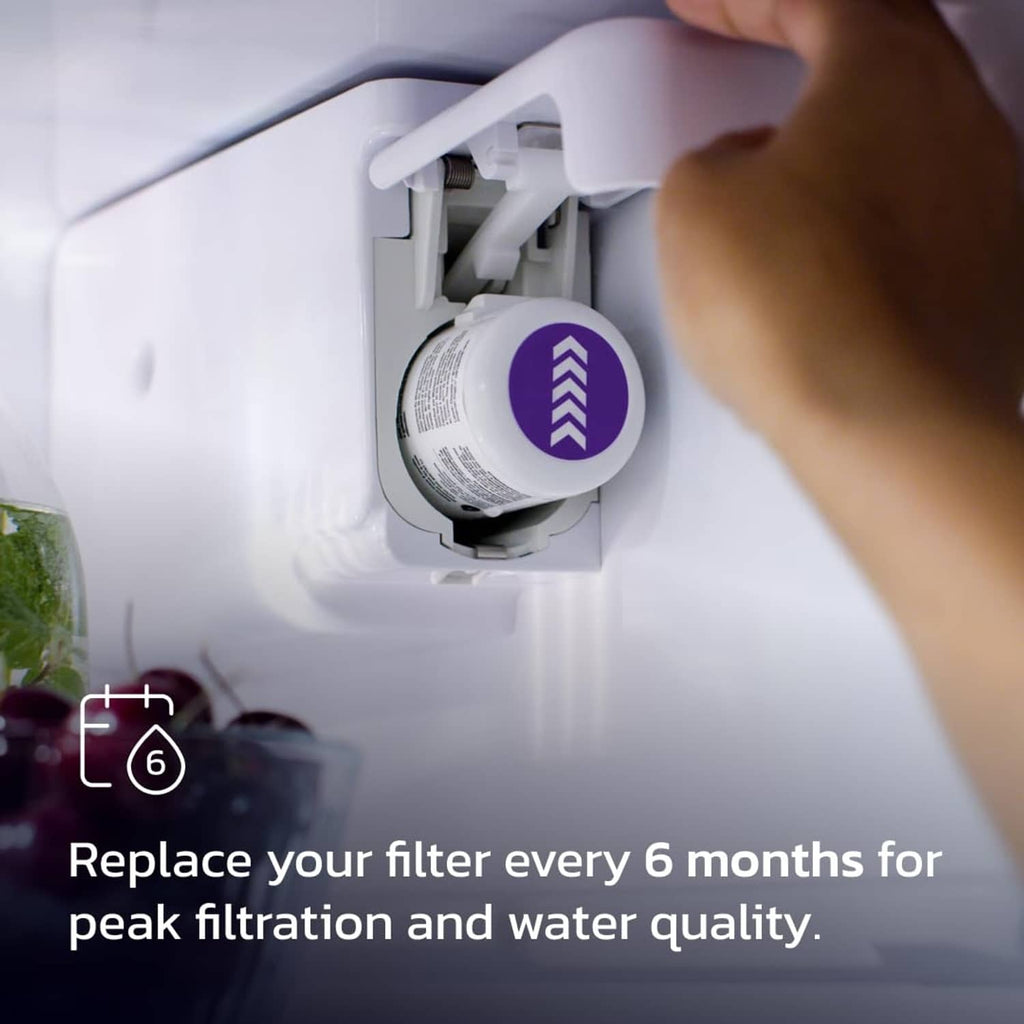 Refrigerator water filter cartridge being inserted into the dispenser housing