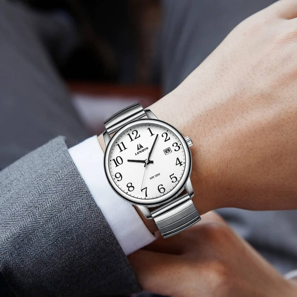 Mens analog quartz watch on wrist with silver metal strap and white dial