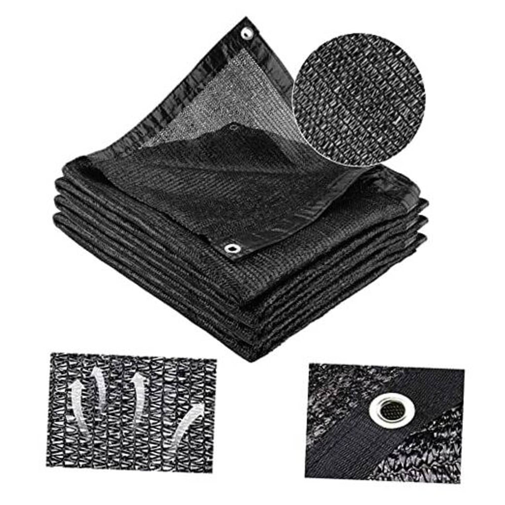 Black shade cloth roll folds with metal grommets for outdoor sun protection