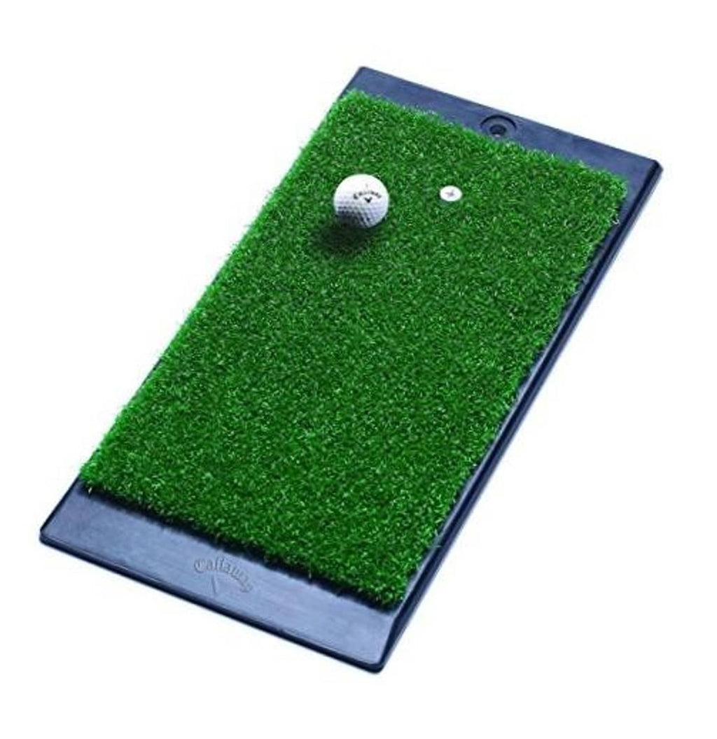 Green turf hitting mat with dark weighted rubber base, golf ball and tee targets