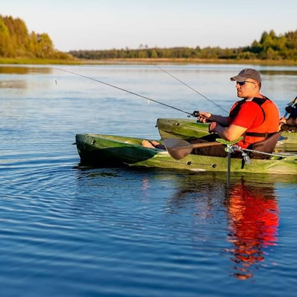 Hi-vis green anchor pole held by angler next to a kayak on calm water