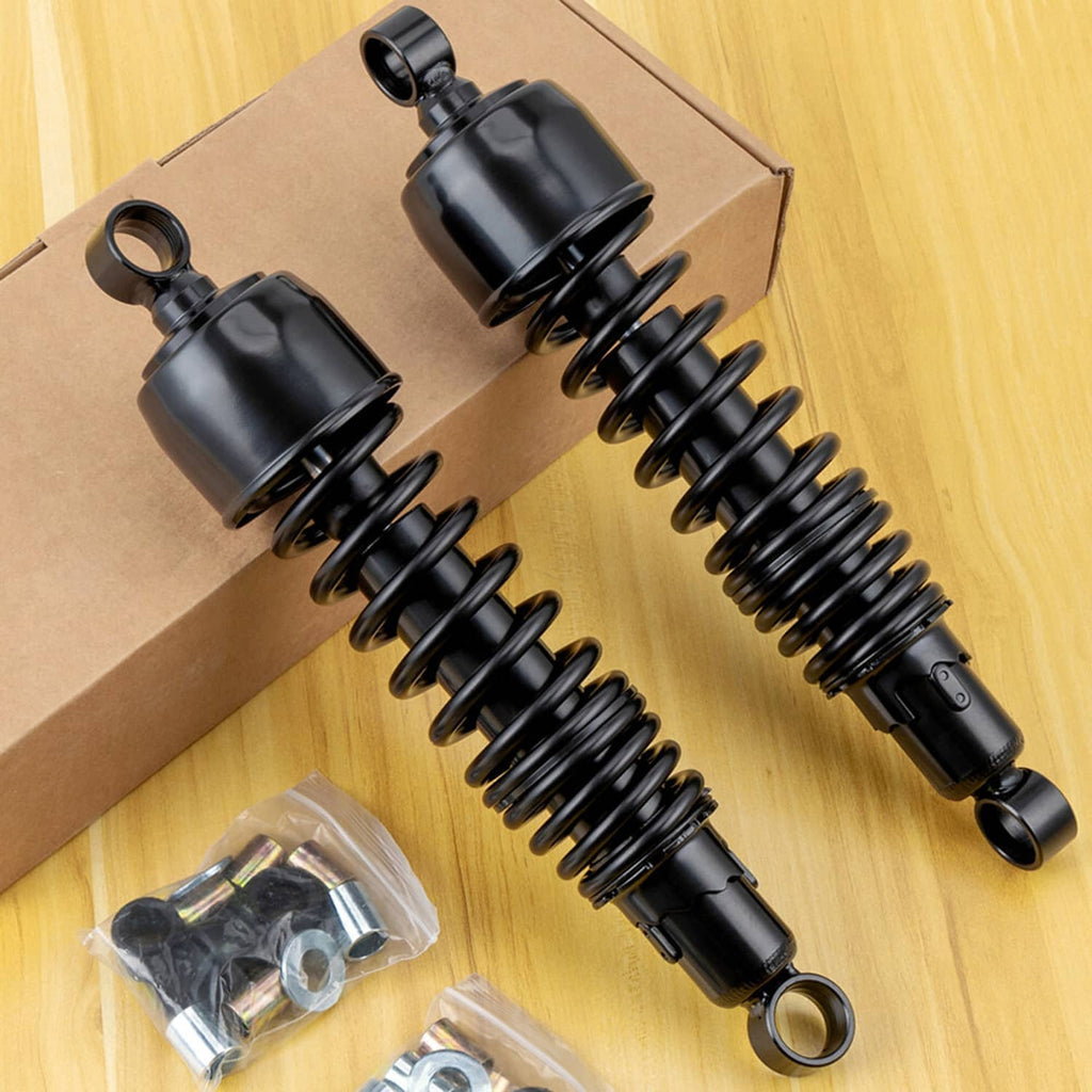 Pair of black rear shock absorbers with coil springs and included mounting brackets