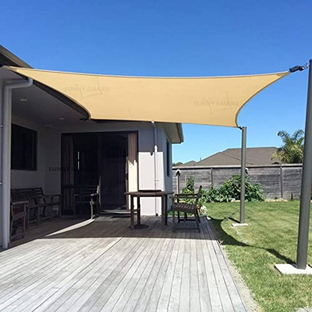 Sand UV shade sail rectangular canopy on metal poles over patio seating area