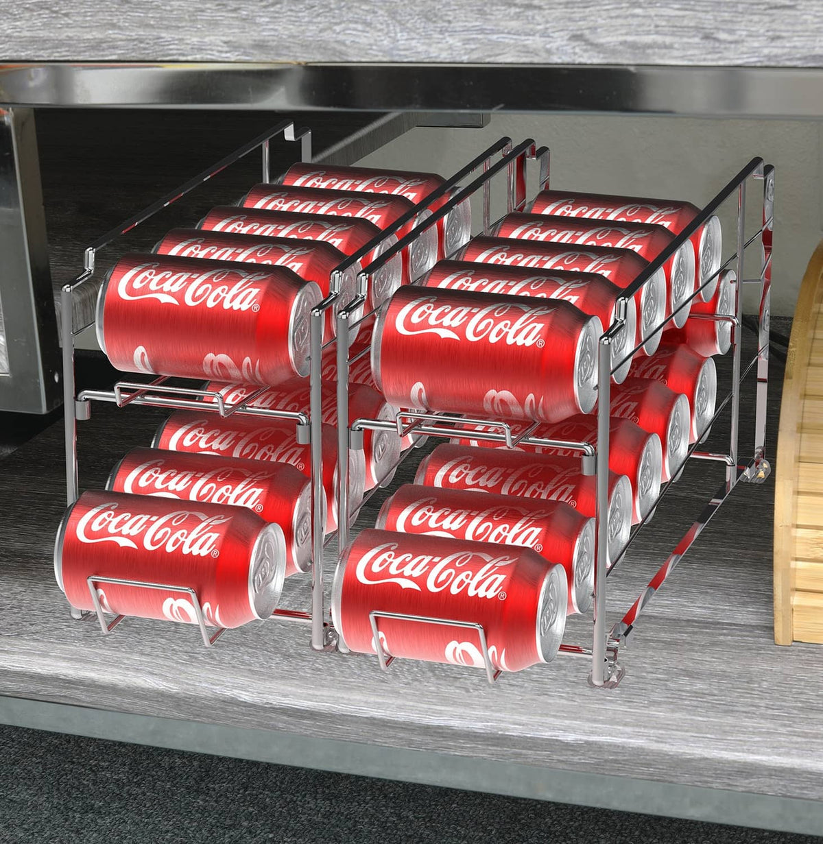 Stackable can dispenser rack in cabinet with multiple red Coca-Cola cans