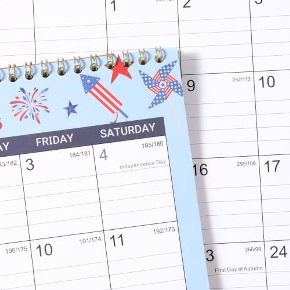 Close-up of 2027 calendar page with US holiday icons and grid dates