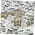 Halloween spider web decoration with black bat decals spread over a house facade