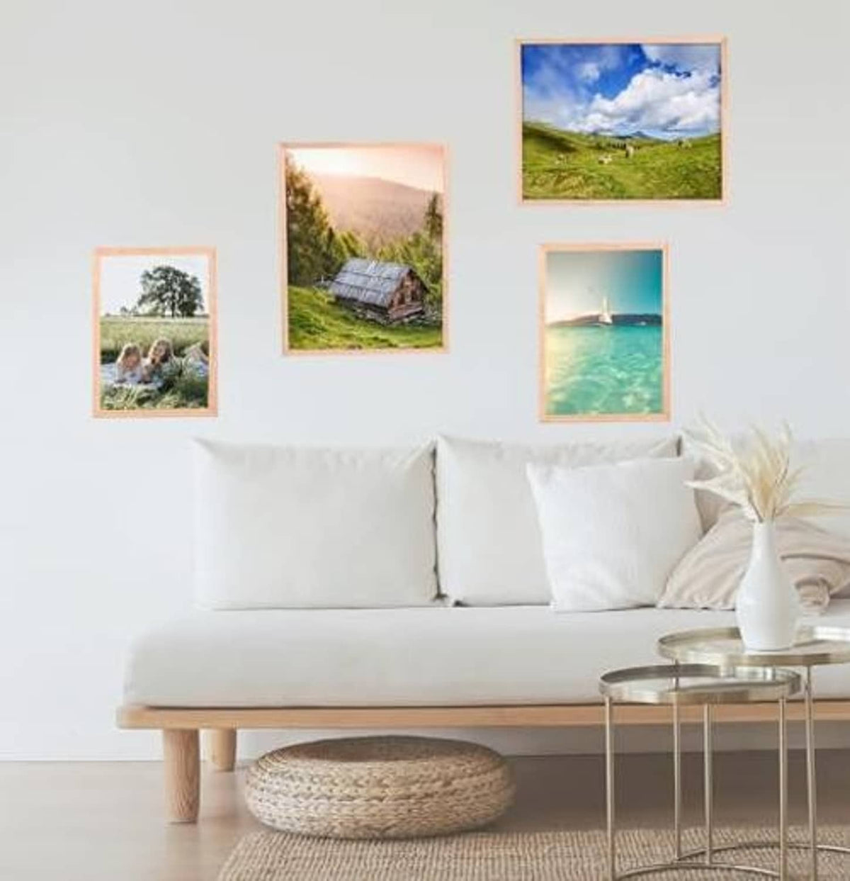 Natural oak 8x10 photo frames arranged on wall above sofa, three visible