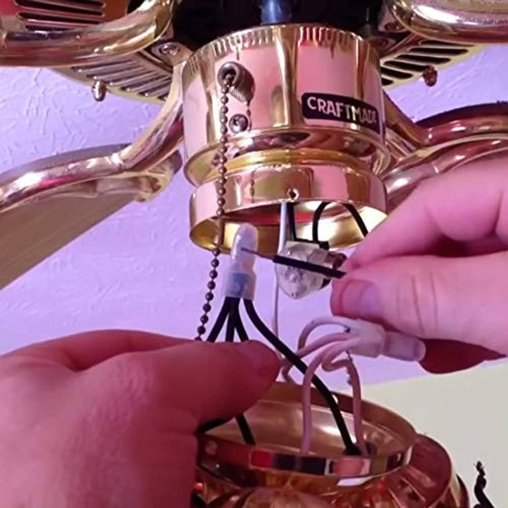 Ceiling fan pull chain switch being connected under a light fixture canopy
