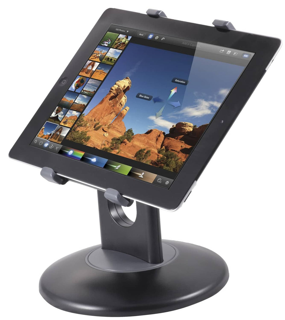 Tablet stand with black round base and gray clamps supporting a tablet at an angle