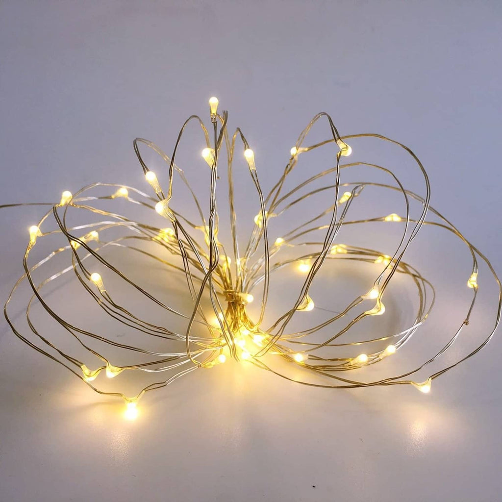 Mini starry string lights with warm LED bulbs on thin silver wire