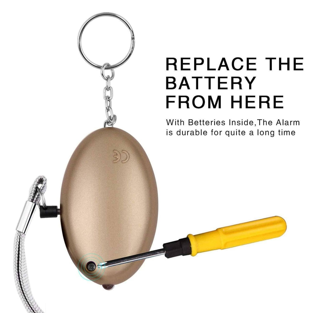 Brown oval personal security alarm fob with key ring and opened battery compartment