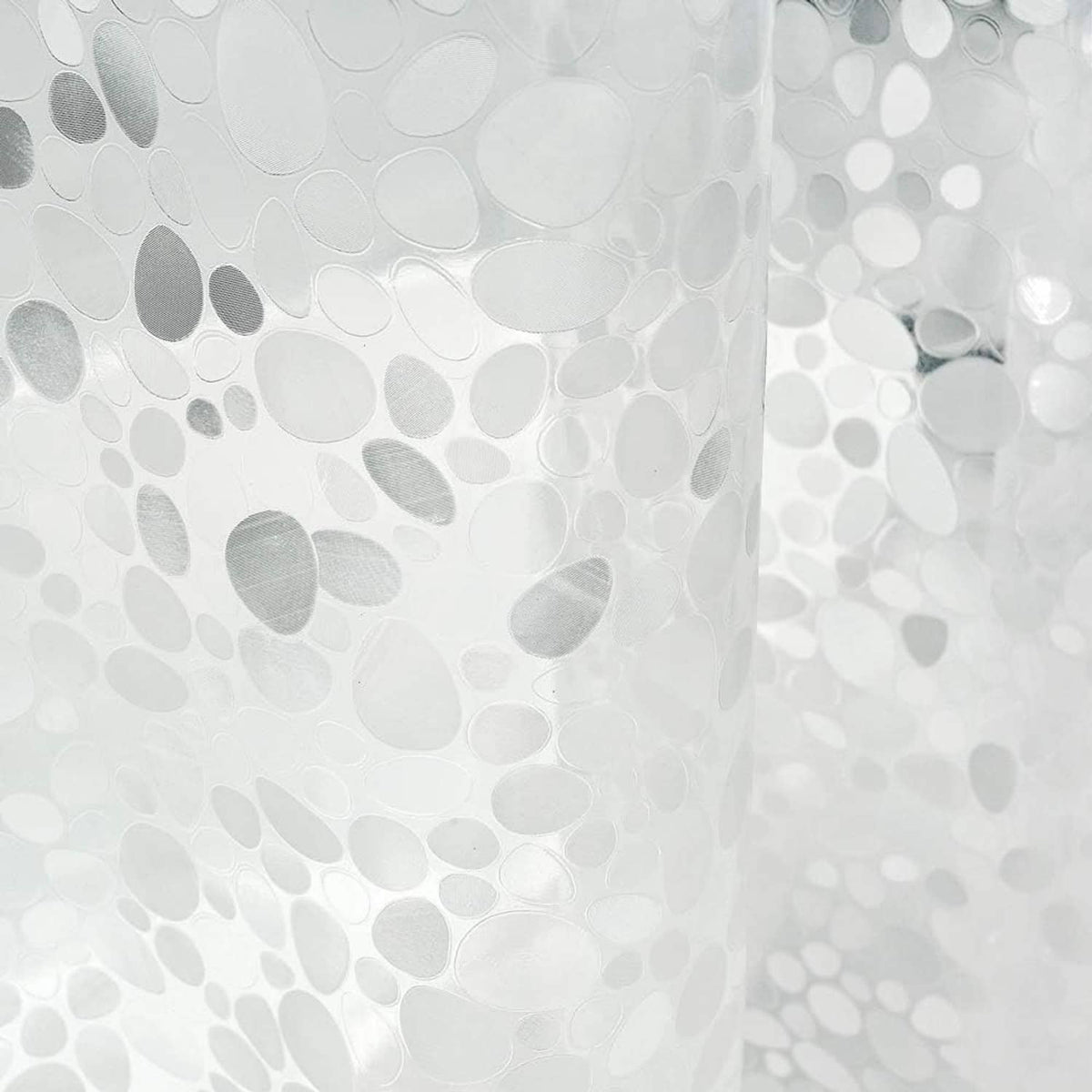 Clear shower curtain liner with bubble-like pattern and leaflike magnets with pink flowers