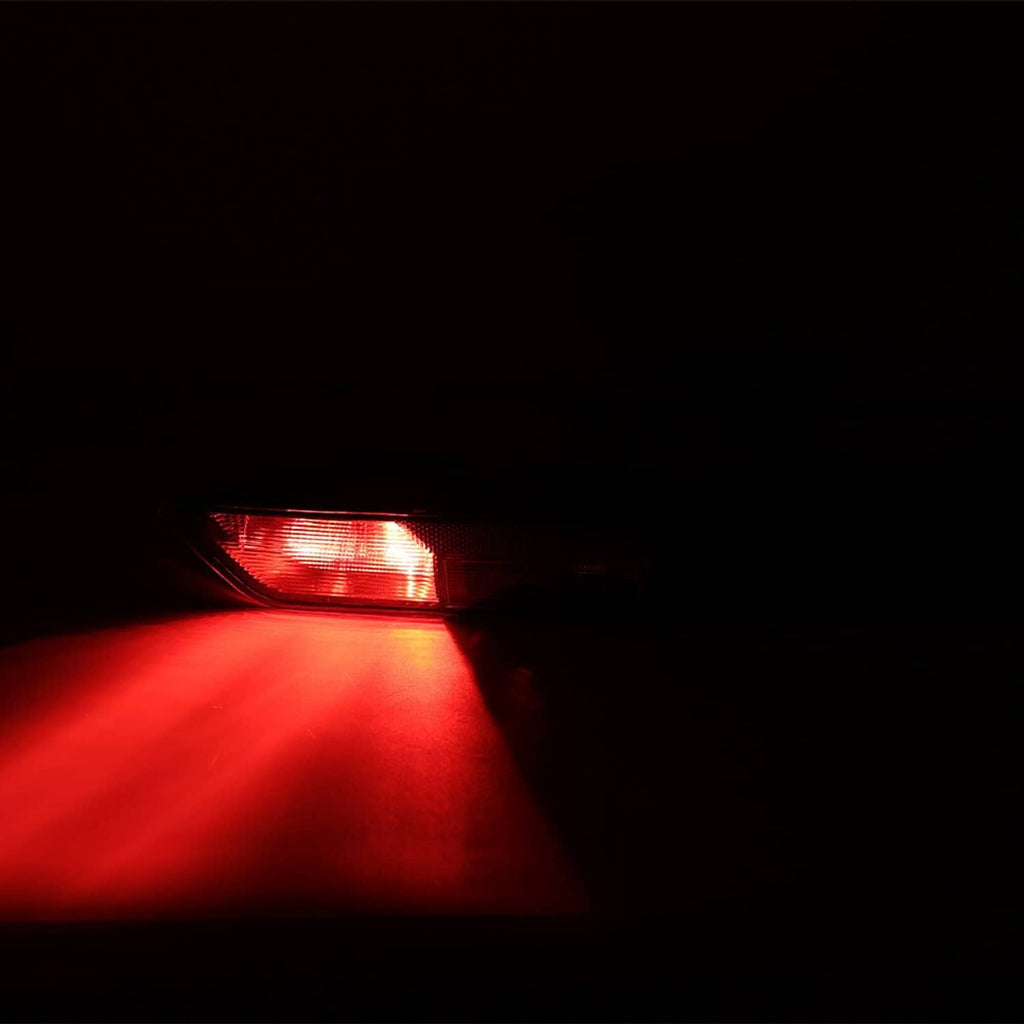 Rear tail light with red glow and white indicator strip in dark housing