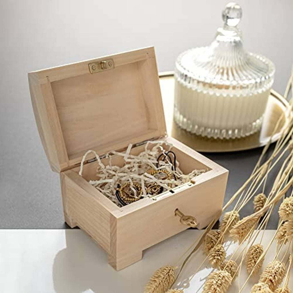 Open wooden jewelry box with compartment holding assorted jewelry pieces
