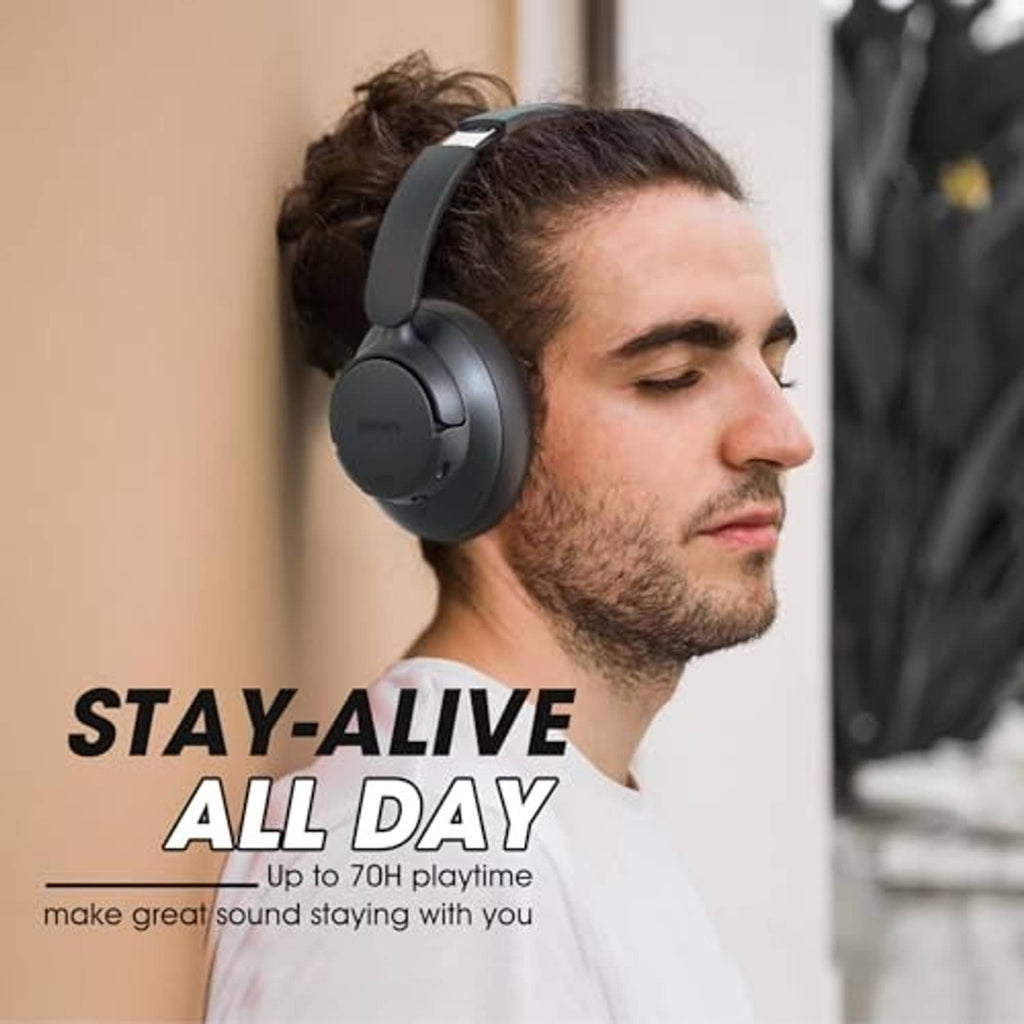 Person wearing transparent black over-ear hybrid noise cancelling headphones