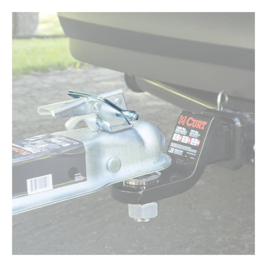 Installed trailer coupler latch pin with wire retainer clip on a steel hitch beam