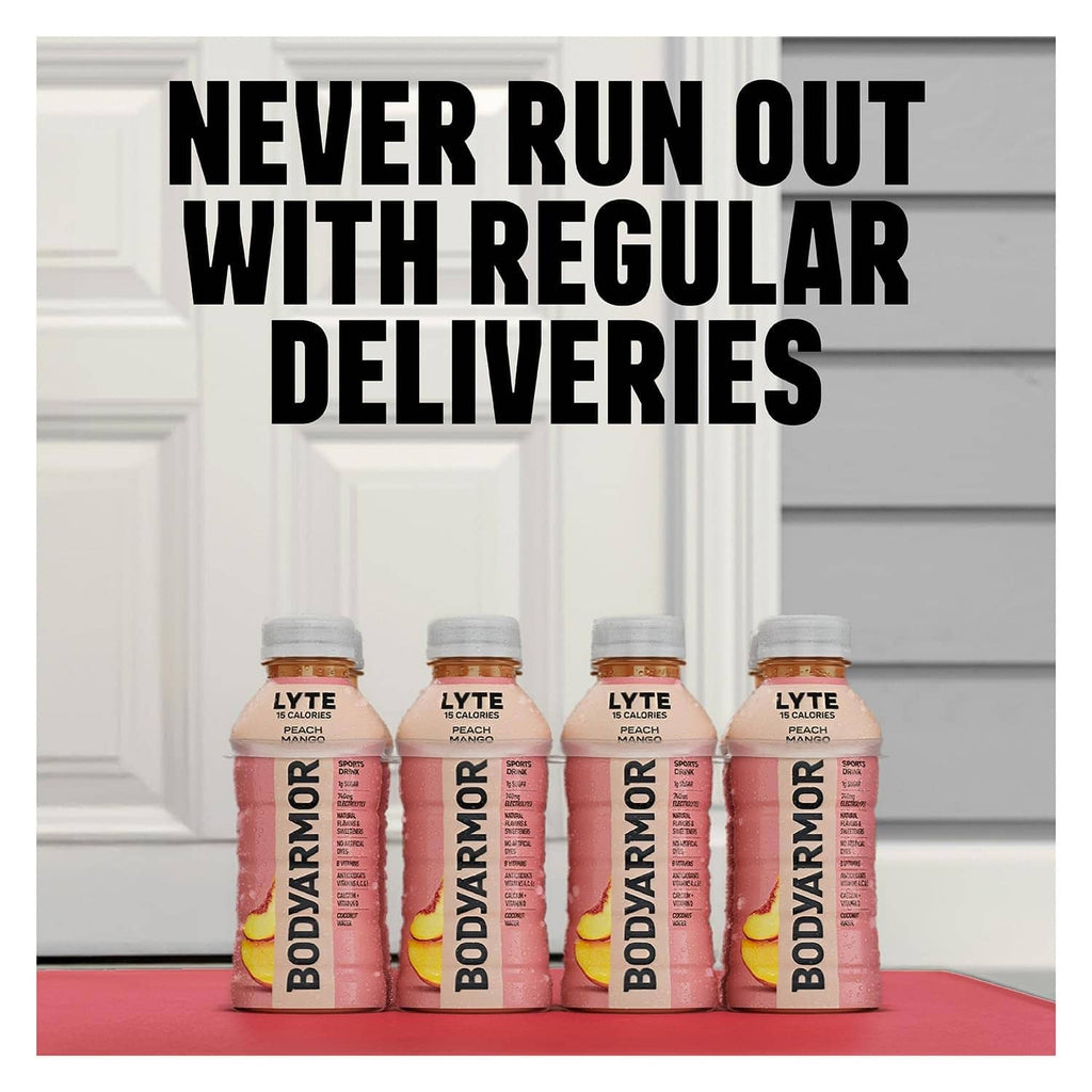 Peach mango sports drink bottles on a doorstep, four-pack visible