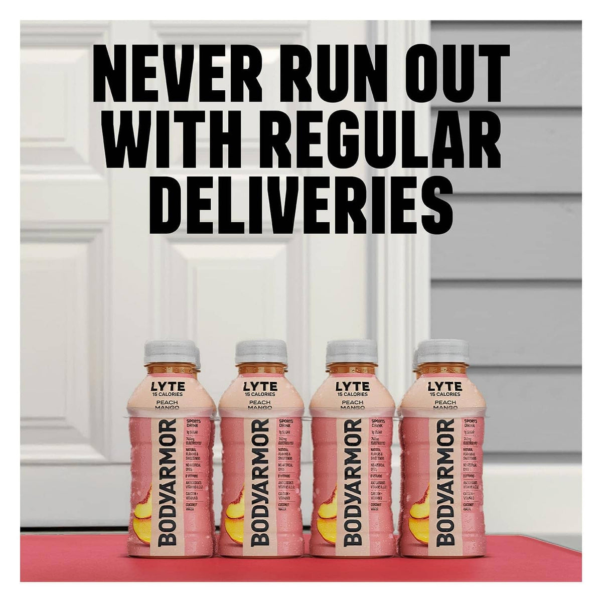 Peach mango sports drink bottles on a doorstep, four-pack visible