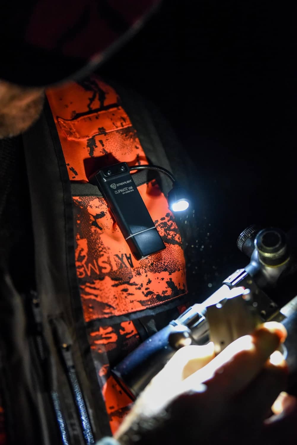 ClipMate light shining while mounted near vehicle components, beam visible