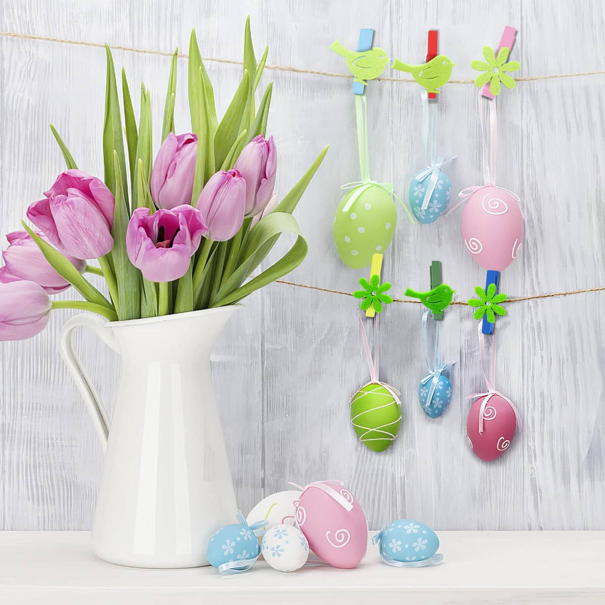 Colored wooden clothespins holding pastel eggs and small decor pieces