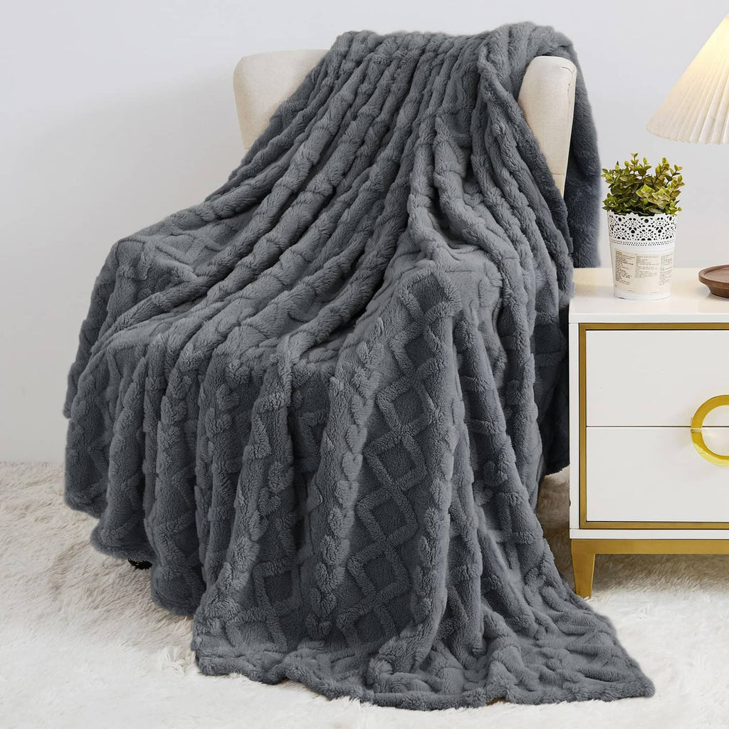 Gray plush blanket with thick raised diamond and cable knit pattern