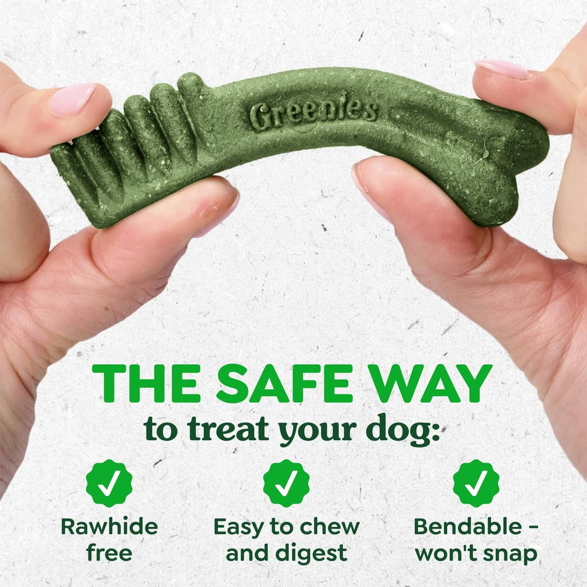 Hands holding a bent green dental treat, bendable and safe to chew