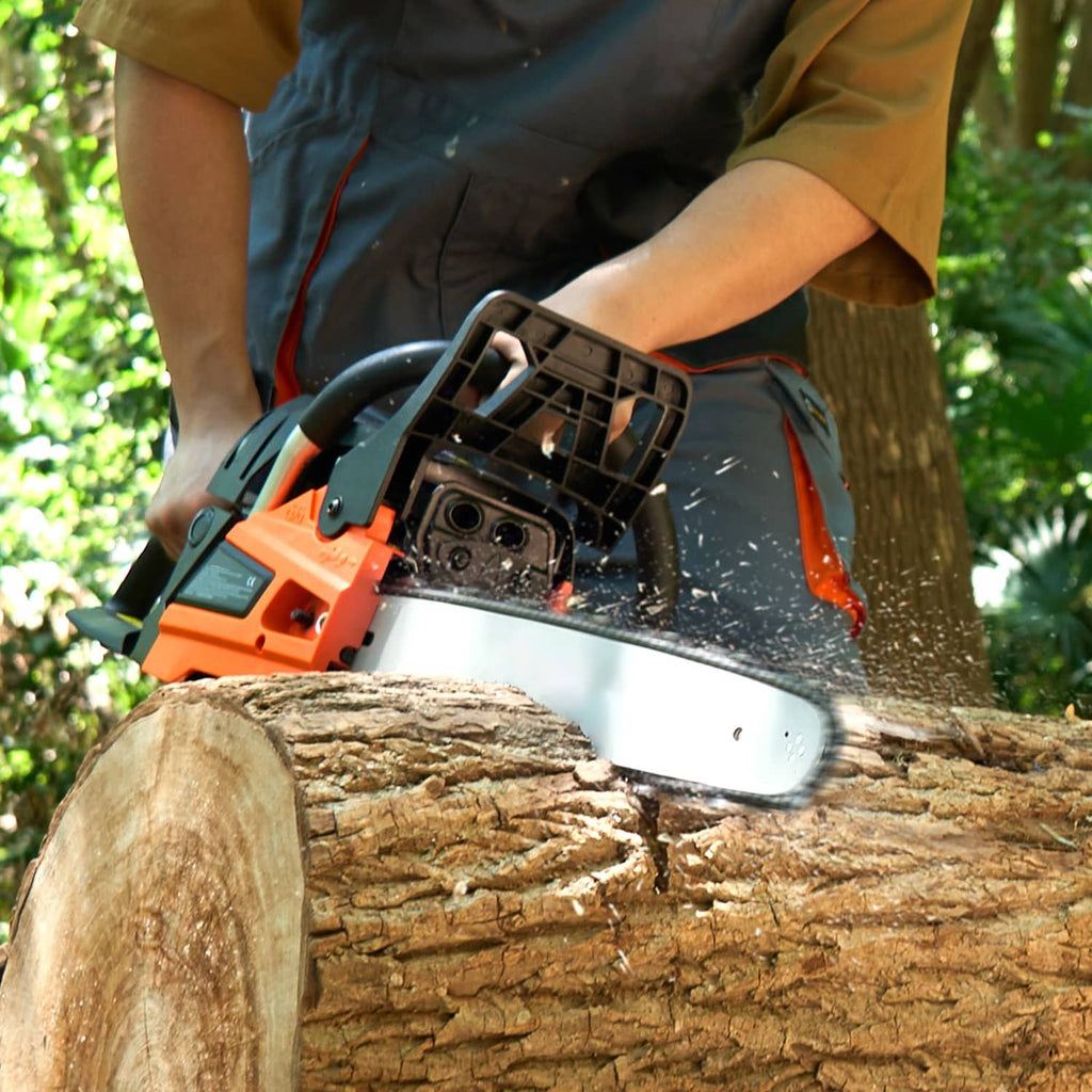 Orange and black 18-inch gas chainsaw cutting through a wooden log