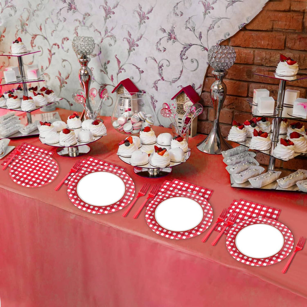 Red and white gingham party table display with plates and napkins on tablecloth