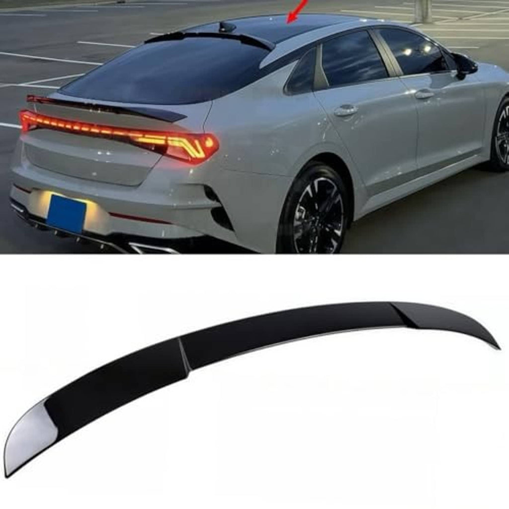 Black roof spoiler with aerodynamic duckbill shape installed on sedan