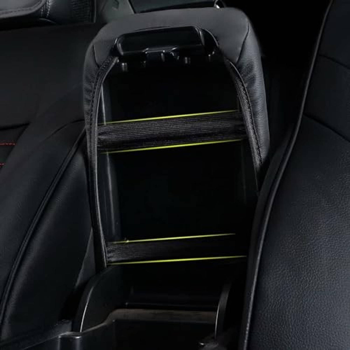 Black fold-up armrest with open storage compartment and interior base