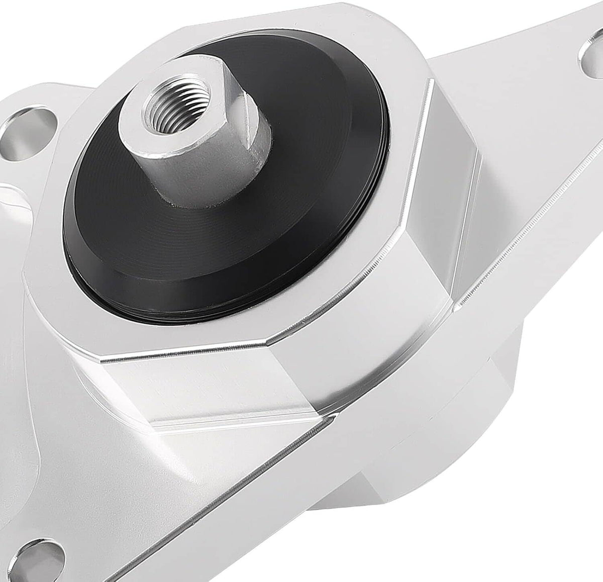 Close-up silver motor mount with black rubber bushing and centered threaded hole