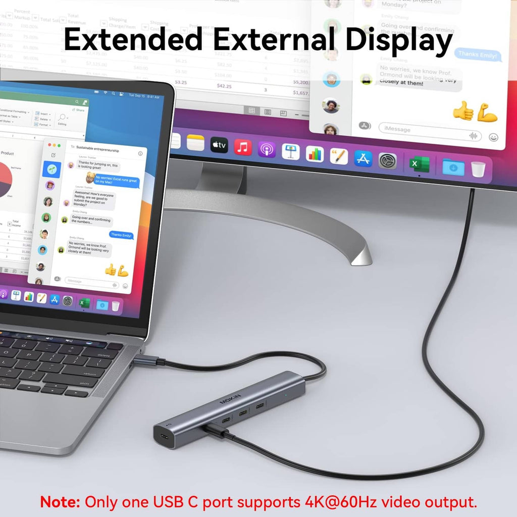 USB-C hub connected to a laptop with an external display via cables