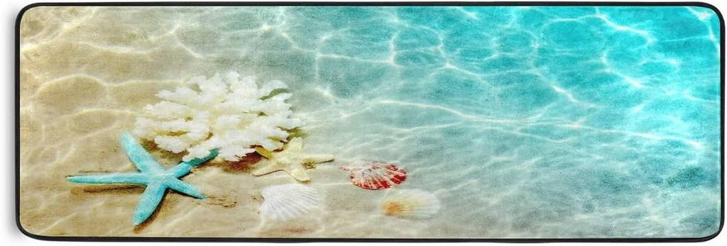 Teal ocean bath rug with starfish and seashell print, rounded corners, black border