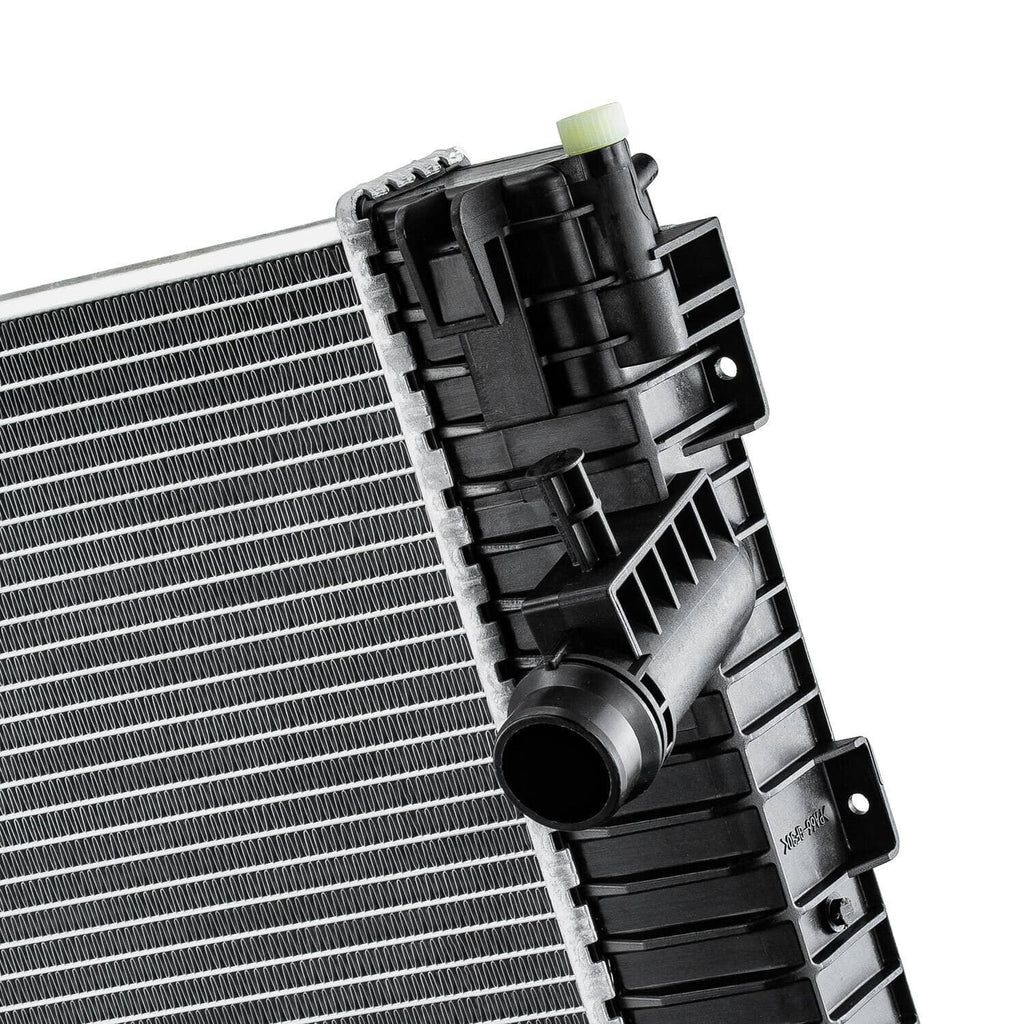 Automotive radiator end assembly with black fan shroud housing and silver fin core