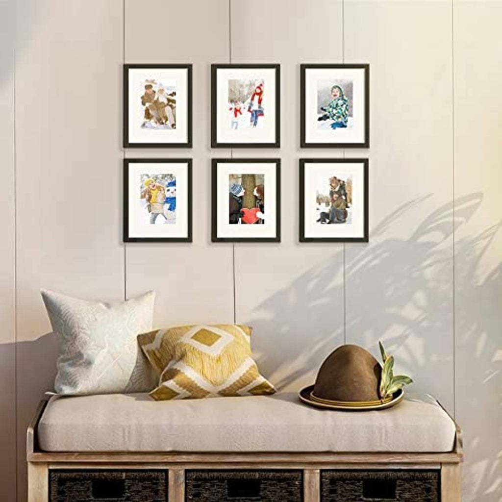 Black picture frame set with multiple photos displayed