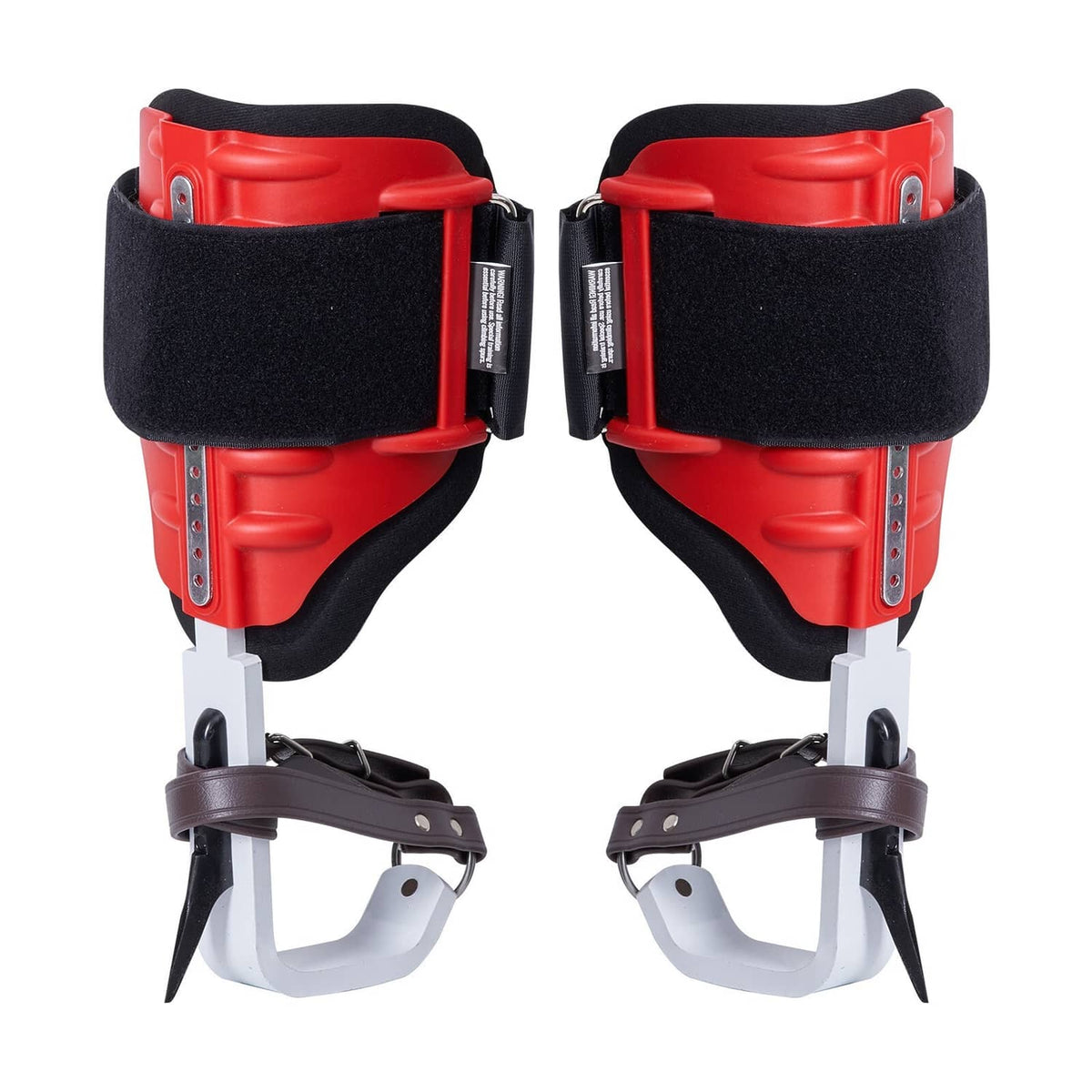 Tree climbing spurs set with red pads, black straps, and sharp steel spikes