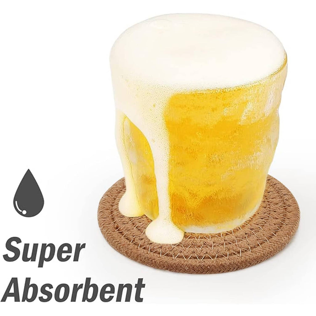 Round woven drink coaster under a beer mug with foam overflow, tan braided texture