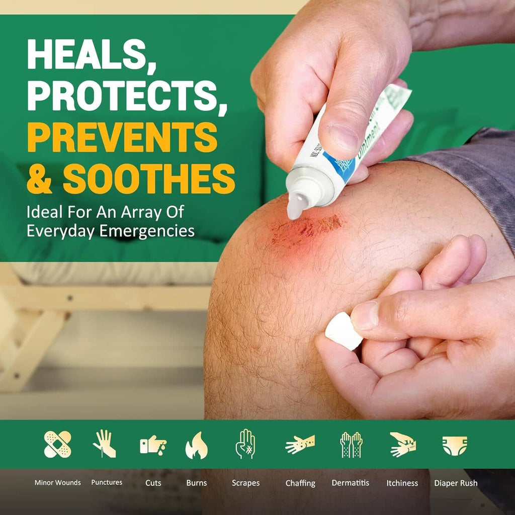 Bacitracin zinc antibiotic ointment tube applying to forearm skin with hands
